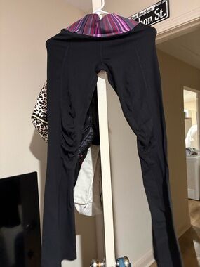 lululemon athletica Black Flare Leggings with Pink & Purple Fold-Over Waistband
